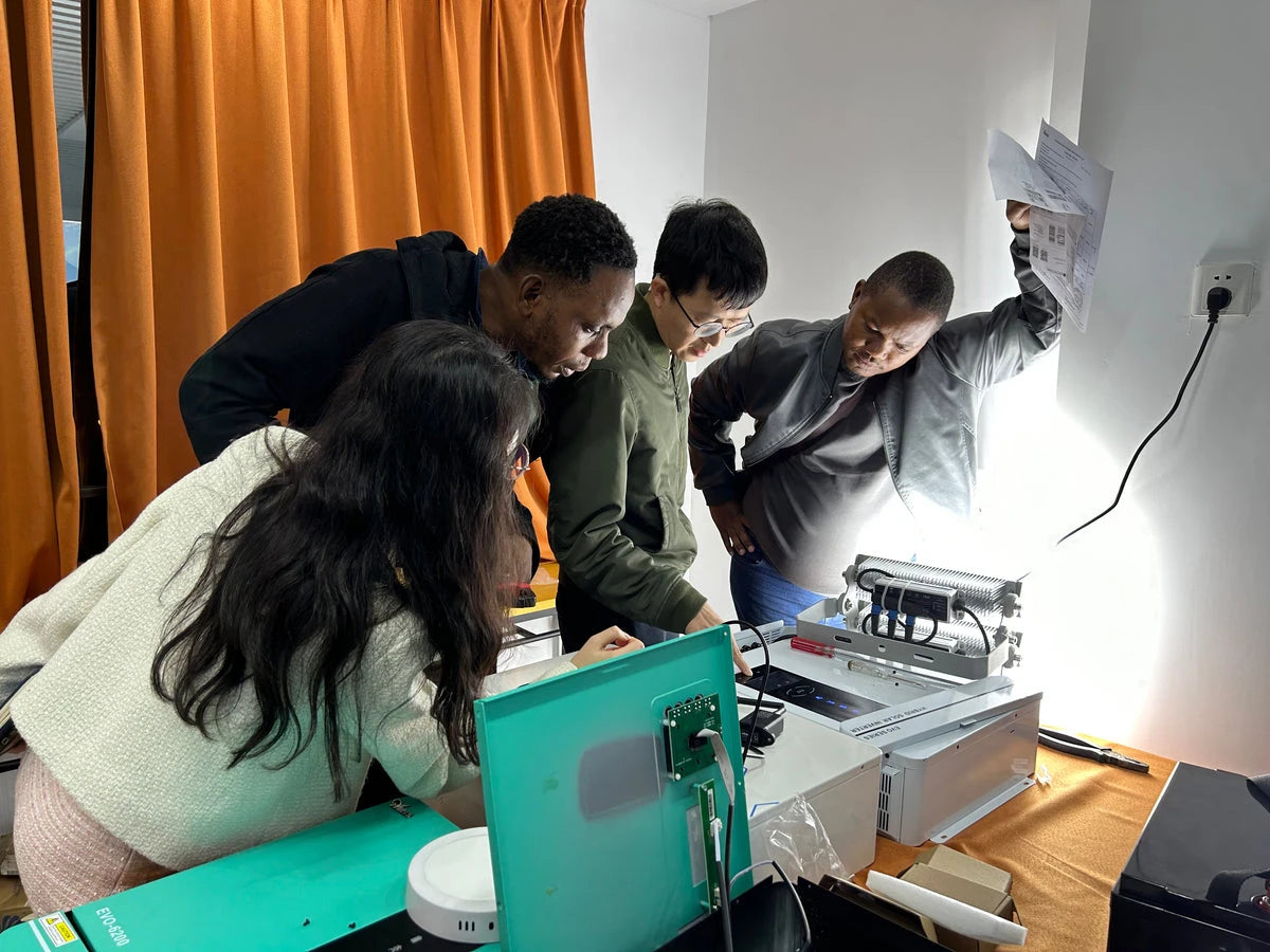 Anern team demonstrating solar energy products during a partner visit